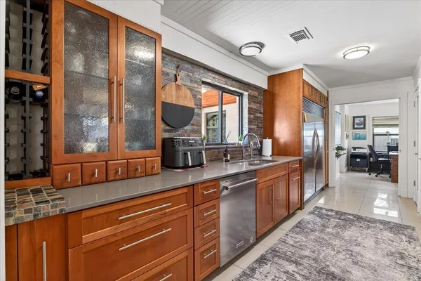 a kitchen with furniture a stove and a chandelier