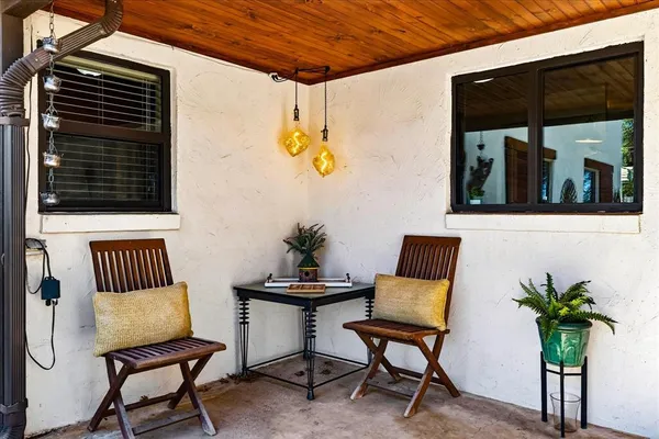 a view of living room filled with furniture