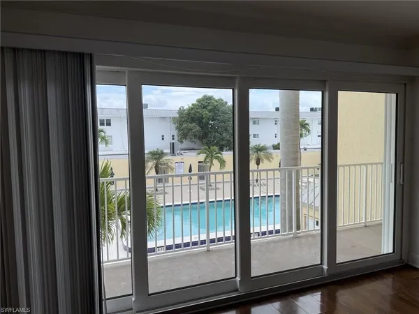 a view of a glass door and deck