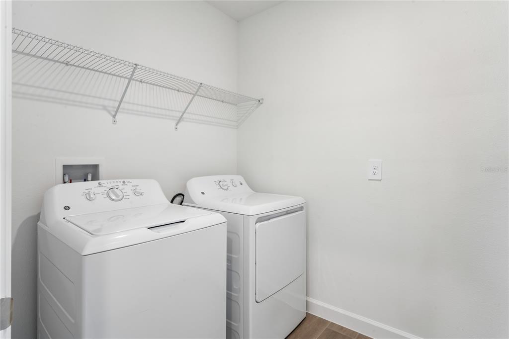 6692 Homebound Way New Port Richey, FL 34653 - Photo 35 of 47 a utility room with dryer and washer
