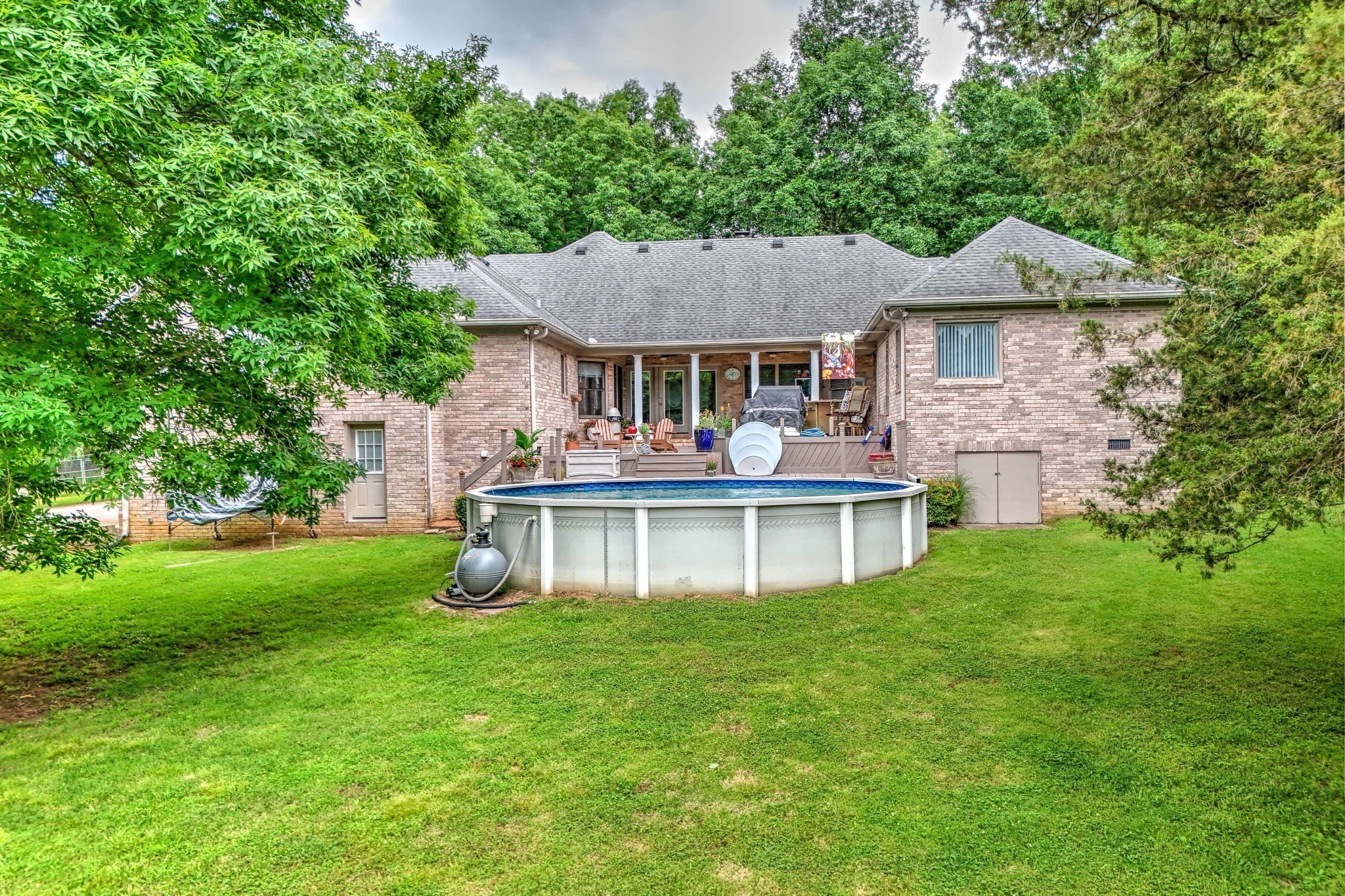 5544 South New Hope Road Hermitage, TN 37076 - Photo 34 of 62 a front view of a house with a garden and lake