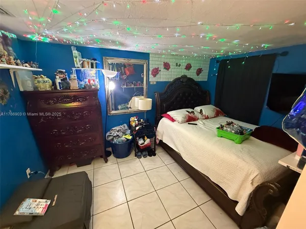 a bed room with a bed and a window