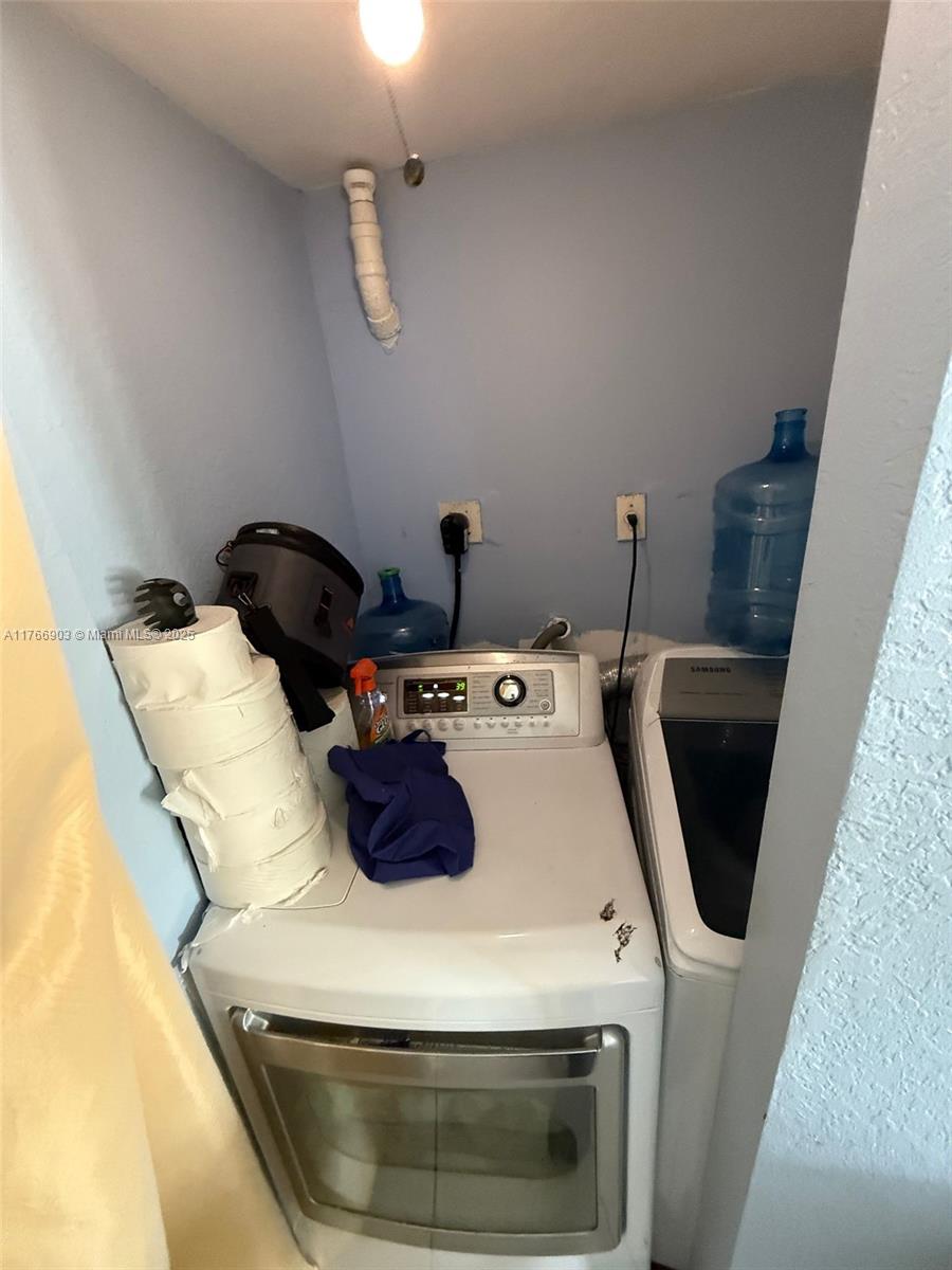 417 Northwest 84th Street, Unit 417 Miami, FL 33150 - Photo 24 of 26 a utility room with dryer and washer
