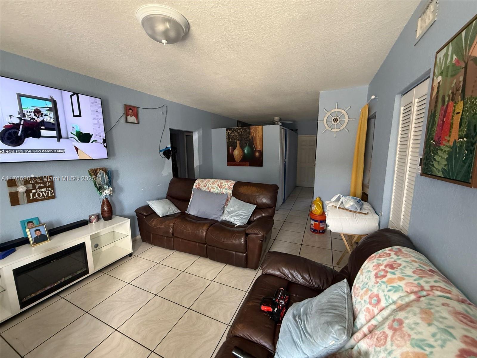417 Northwest 84th Street, Unit 417 Miami, FL 33150 - Photo 26 of 26 a bedroom with furniture and a bed