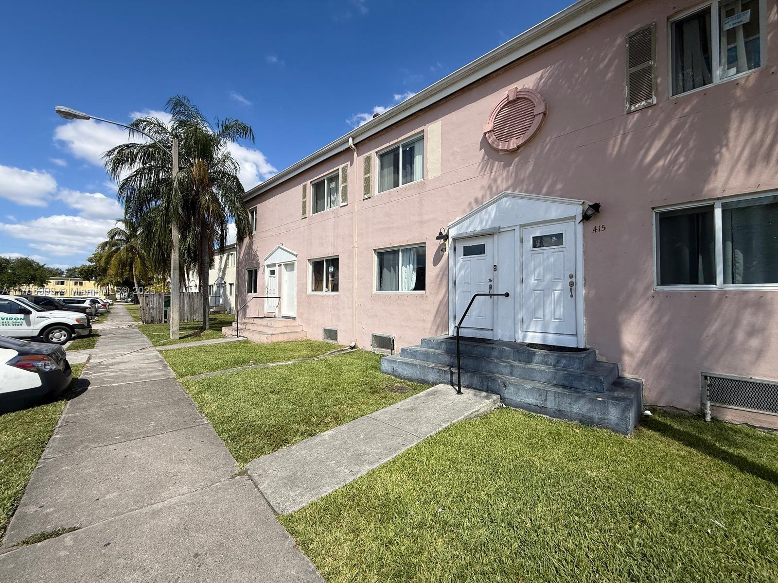 417 Northwest 84th Street, Unit 417 Miami, FL 33150 - Photo 4 of 26 a view of a house with a patio