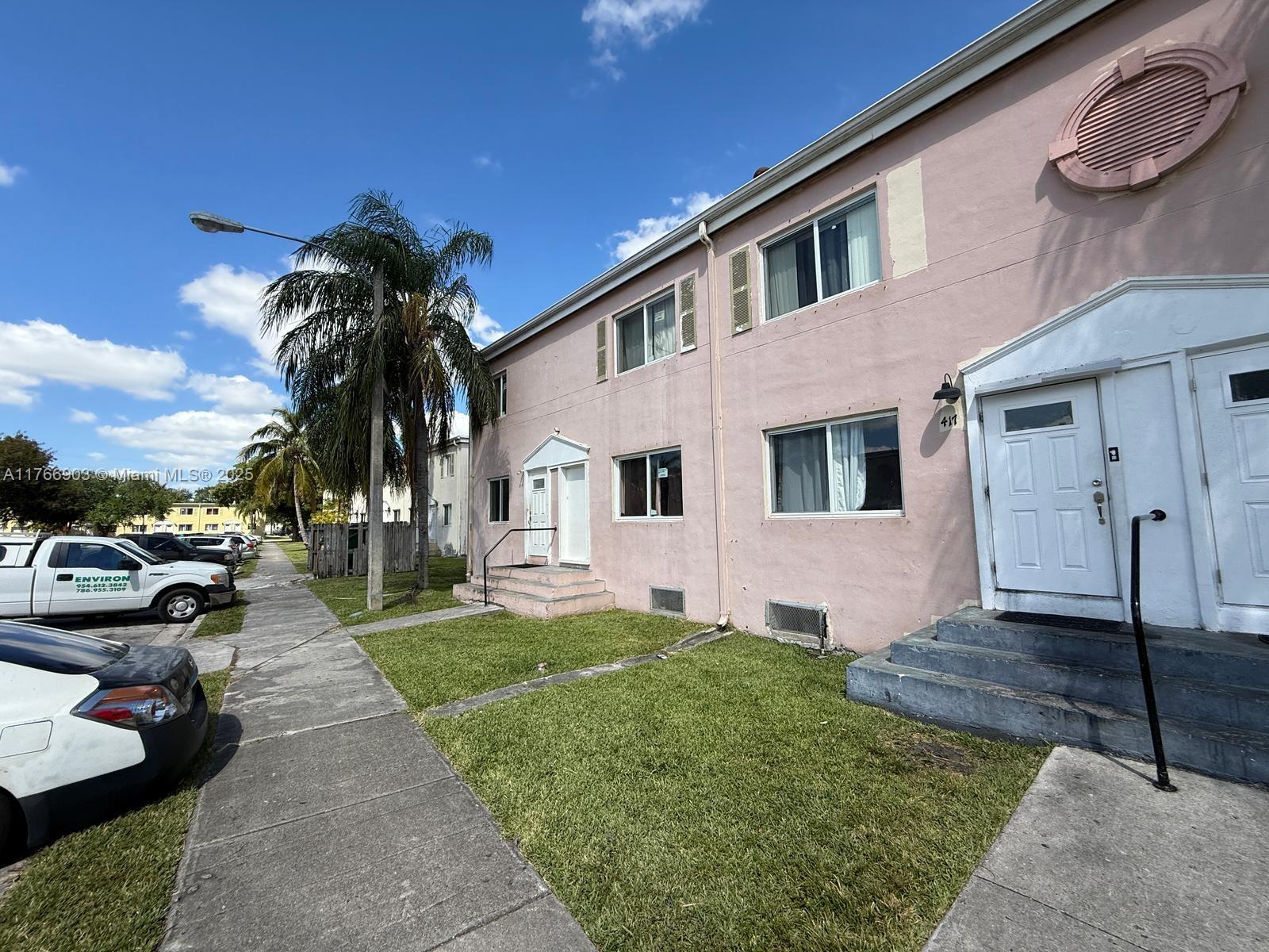 417 Northwest 84th Street, Unit 417 Miami, FL 33150 - Photo 6 of 26 a view of a house with a patio