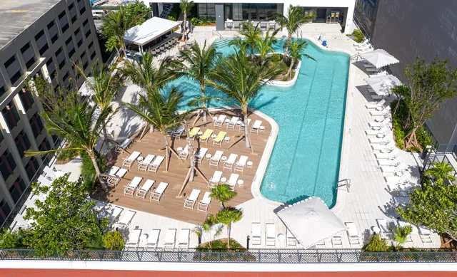 a balcony with a table and chairs
