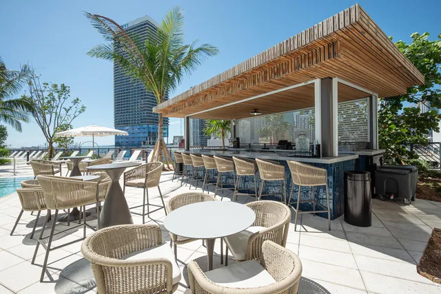 a view of a swimming pool and lounge chairs