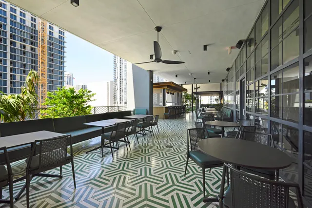 a large kitchen with a table and chairs