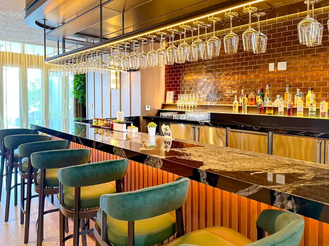 a view of living room with a table and a fireplace