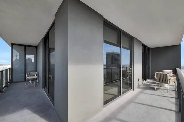 a view of a city skyline from a balcony