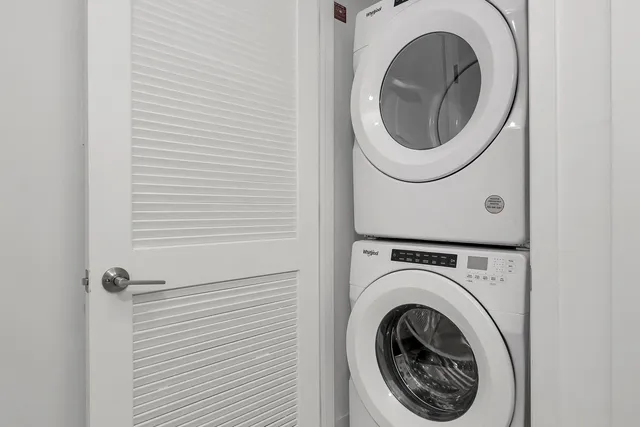 a bathroom with a double vanity sink toilet and shower