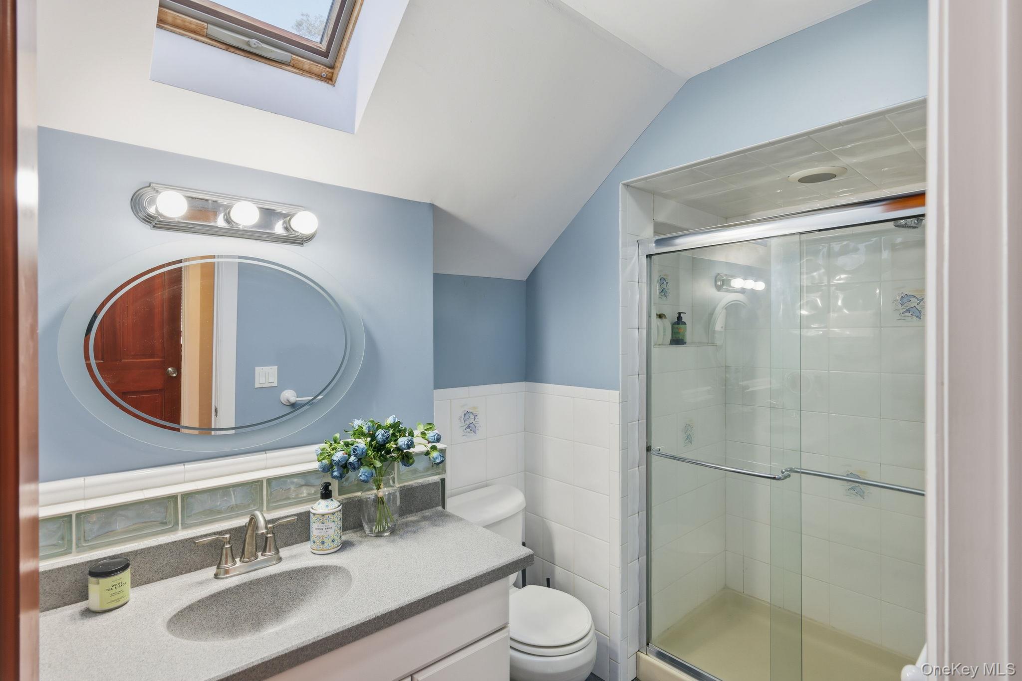 45 Evergreen Avenue Poughkeepsie, NY 12601 - Photo 29 of 43 a bathroom with a sink a toilet and a mirror