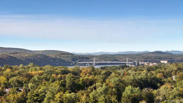 an aerial view of residential house and green space