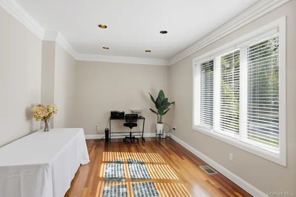 a room with a balcony a bed and a window