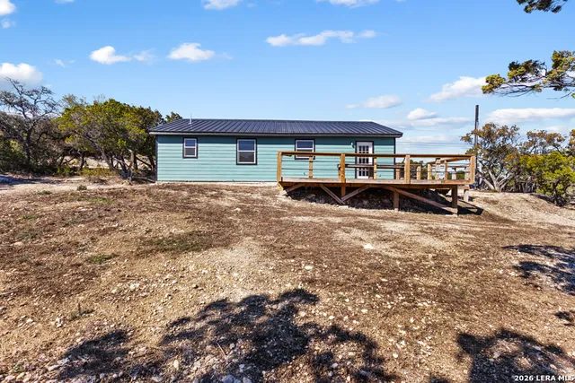 a view of a house with a yard and garage