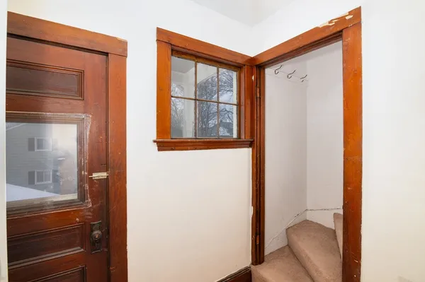 a view of a closet and utility room