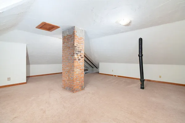 a view of empty room with stairs