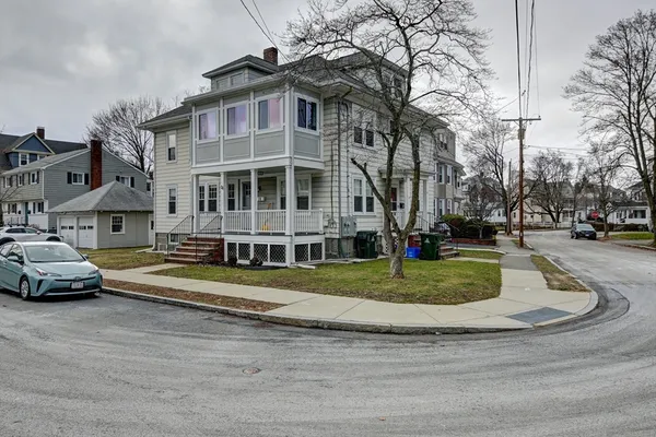 a view of a parked cars in front of a building
