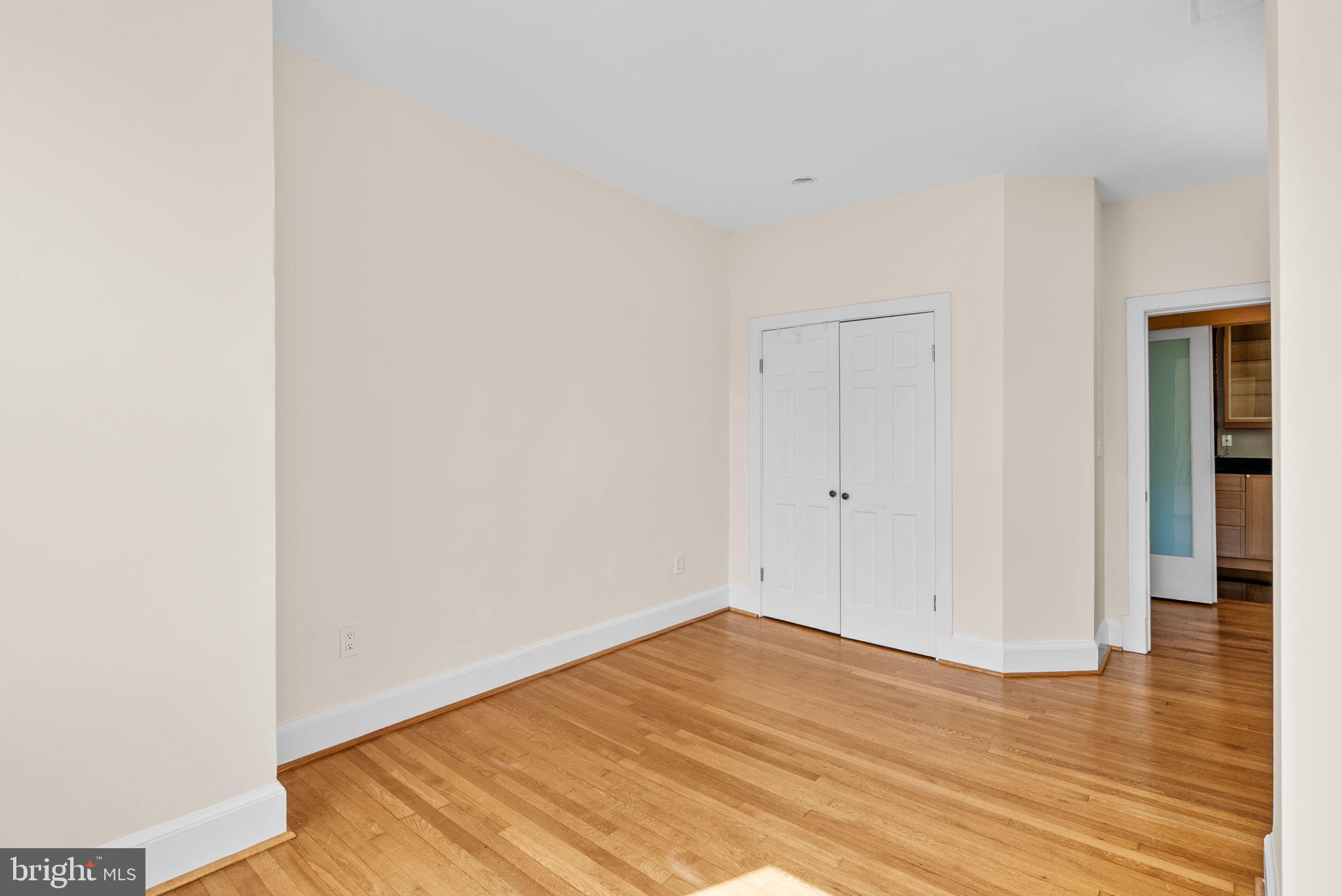 1318 35th Street Northwest, Unit 7 Washington, DC 20007 - Photo 17 of 27 a view of empty room with wooden floor
