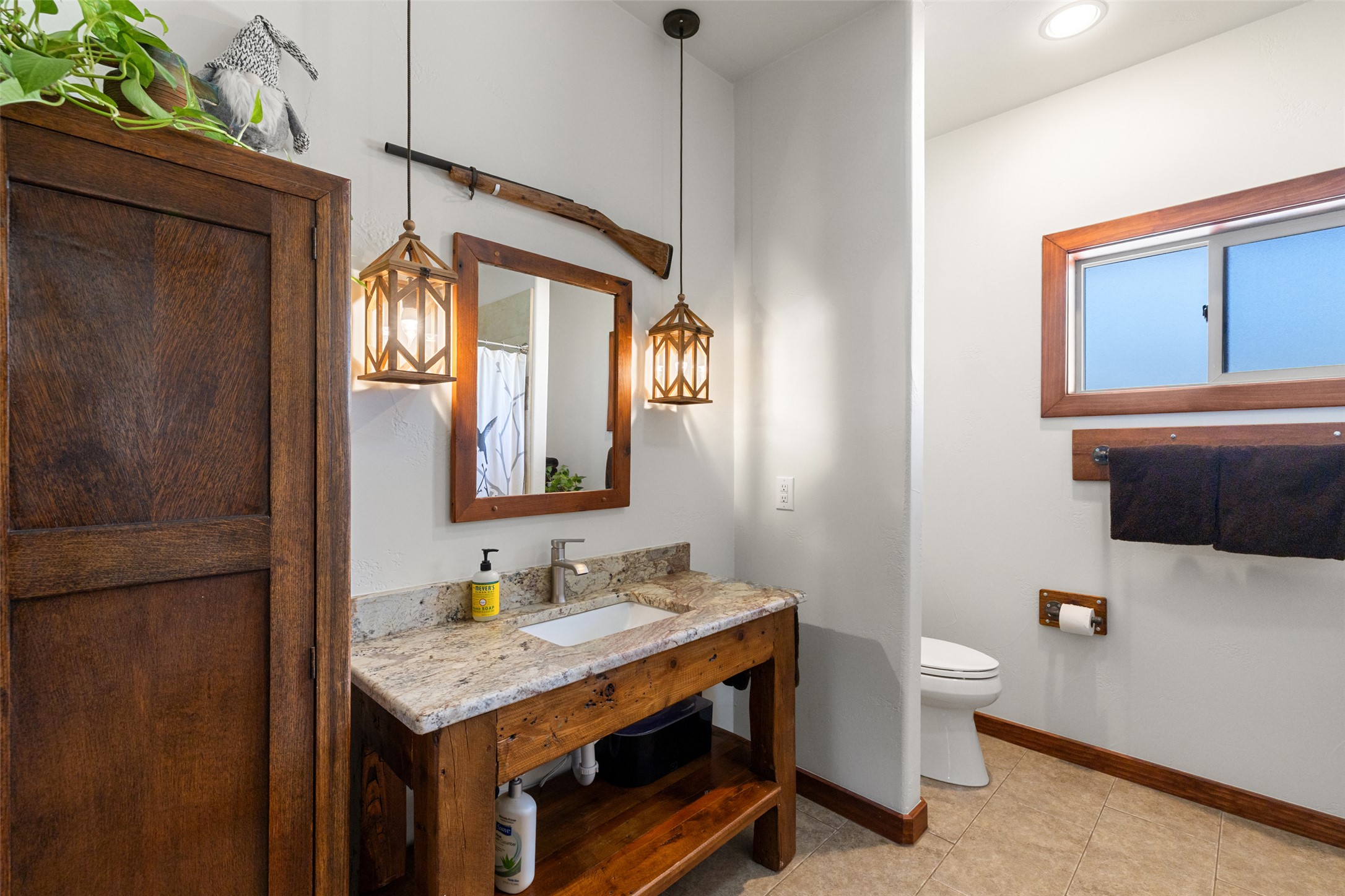 546 Lazy Oak Road Hye, TX 78635 - Photo 20 of 34 a bathroom with a granite countertop sink toilet and shower