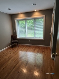 72 Pinnacle Road Ellington, CT 06029 - Photo 13 of 38 an empty room with wooden floor and windows
