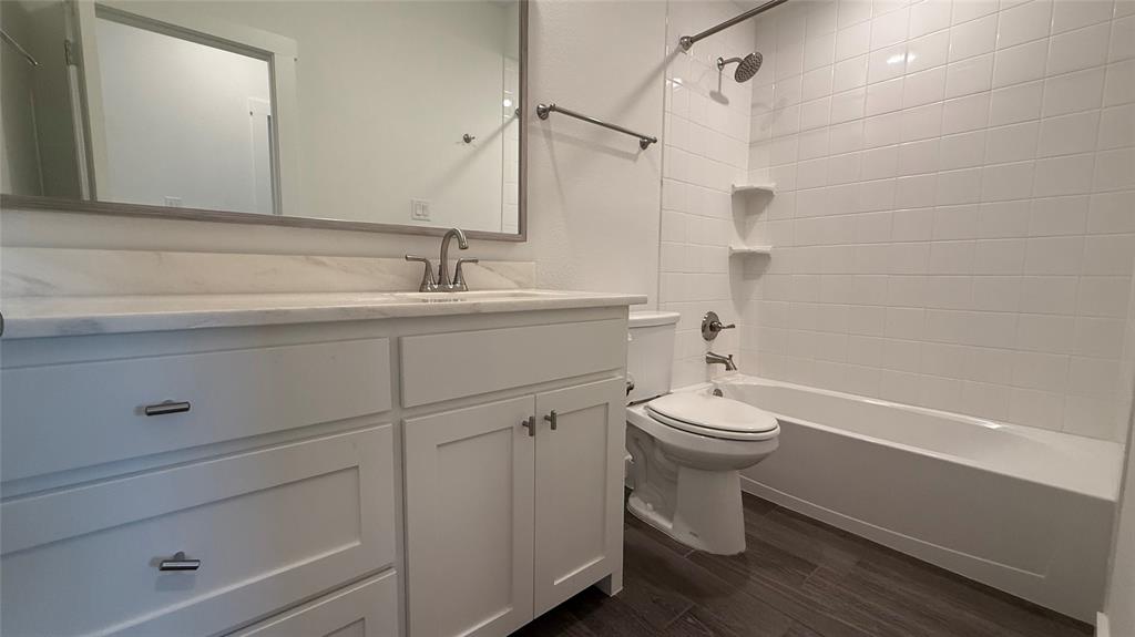 2805 Concord Drive Wylie, TX 75098 - Photo 14 of 19 a bathroom with a sink a toilet and shower