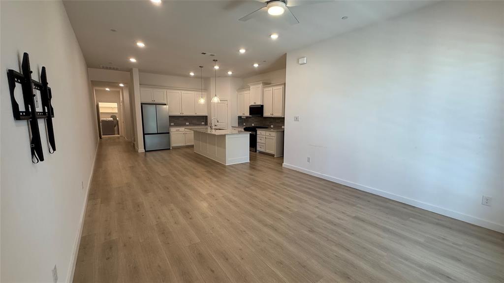 2805 Concord Drive Wylie, TX 75098 - Photo 7 of 19 a view of kitchen with cabinets and wooden floor
