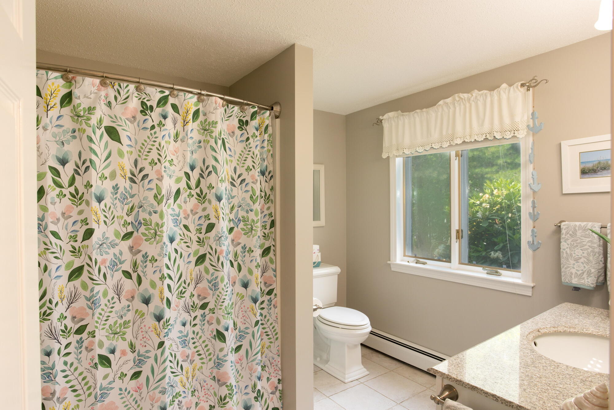 21 Captain Isiah's Road Cotuit, MA 02635 - Photo 15 of 47 a bathroom with a toilet and a shower curtain