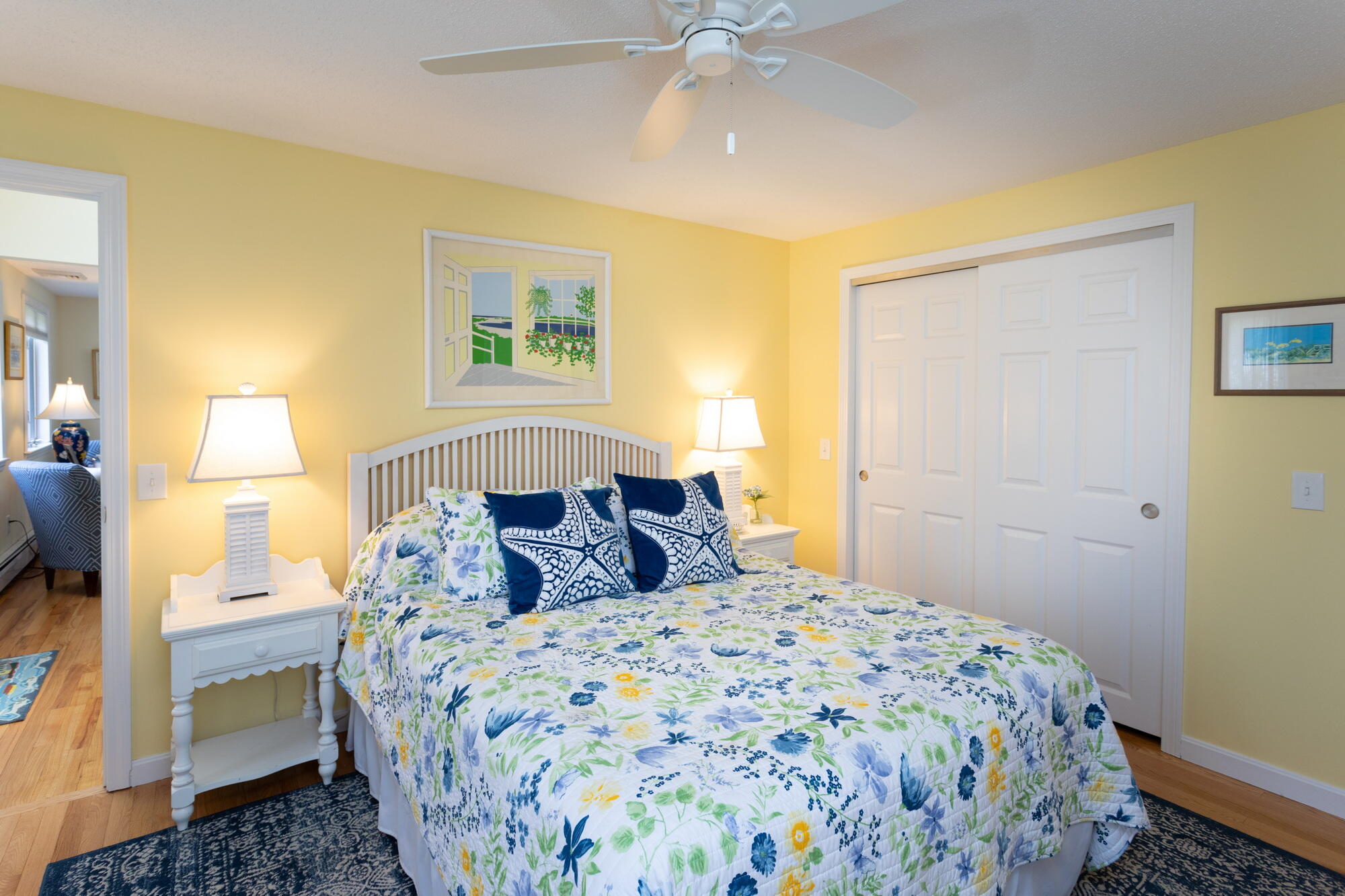 21 Captain Isiah's Road Cotuit, MA 02635 - Photo 18 of 47 a bedroom with a bed and a painting on the wall