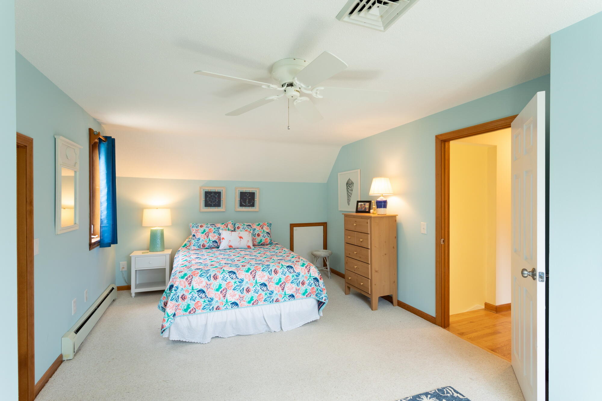 21 Captain Isiah's Road Cotuit, MA 02635 - Photo 20 of 47 a bedroom with a bed and a table