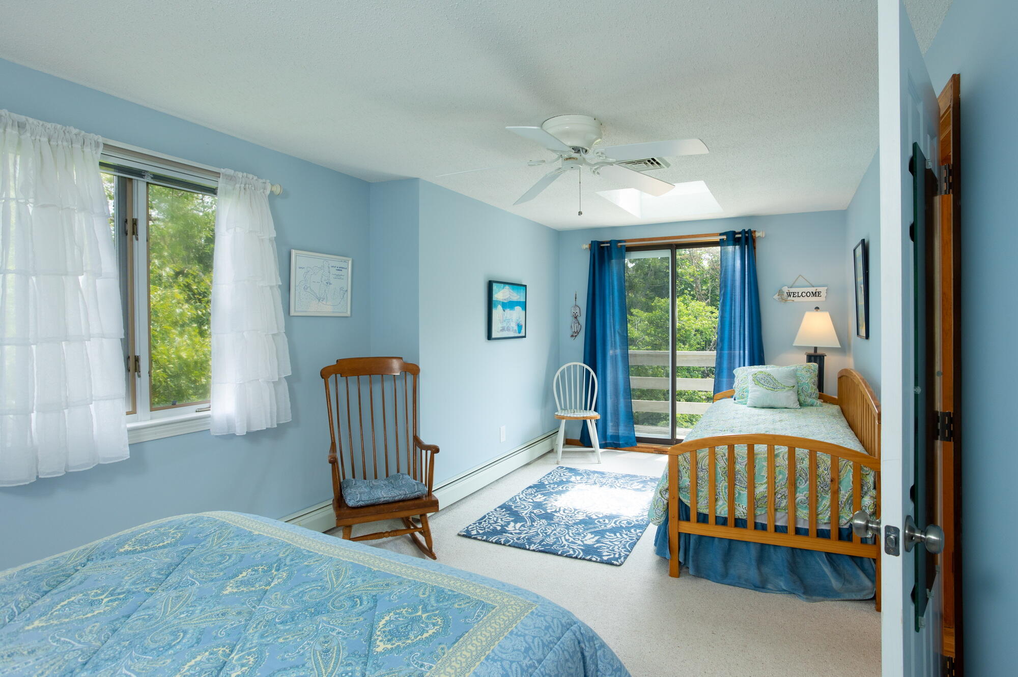 21 Captain Isiah's Road Cotuit, MA 02635 - Photo 22 of 47 a bedroom with a bed and wooden floor