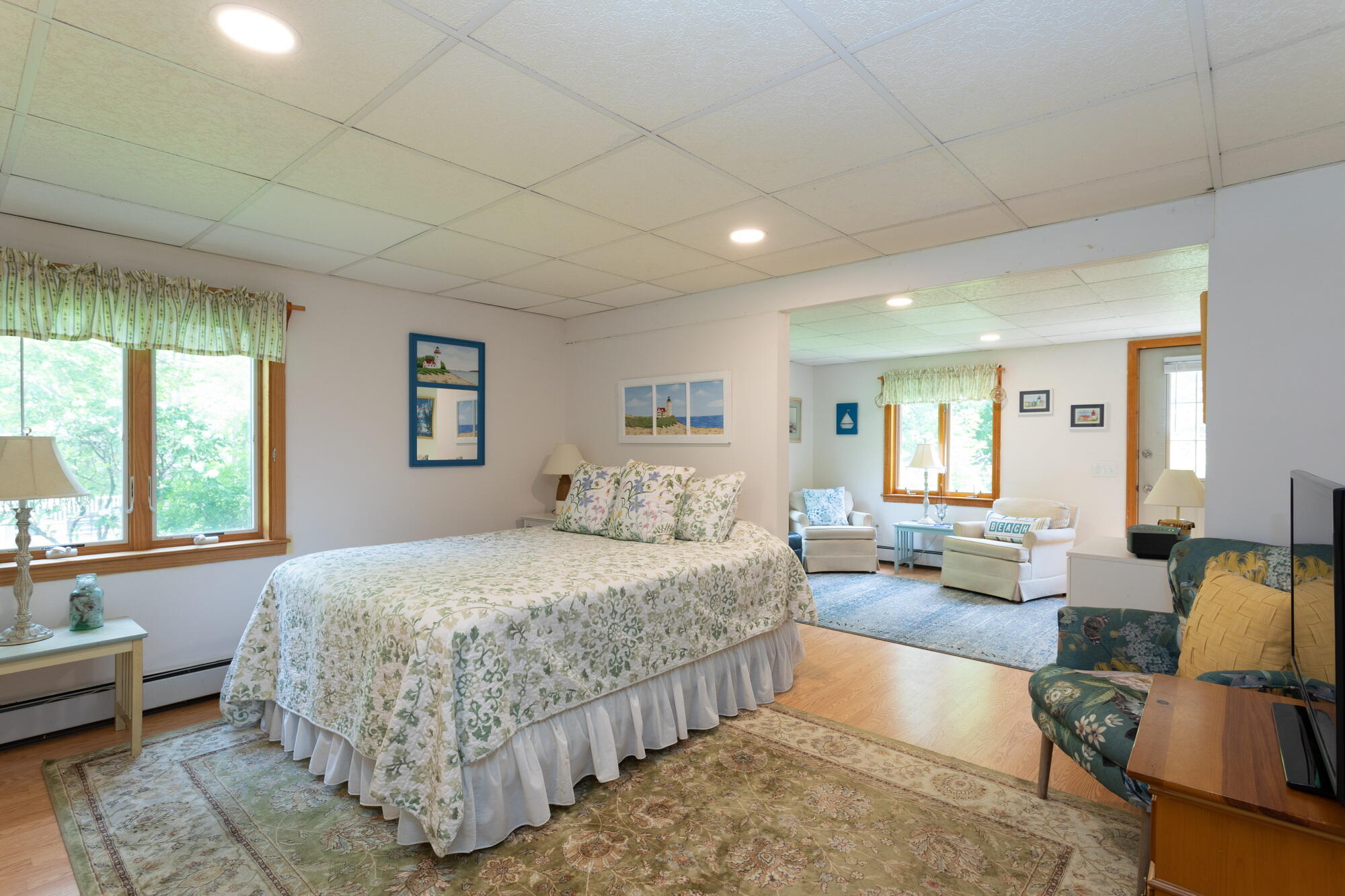 21 Captain Isiah's Road Cotuit, MA 02635 - Photo 29 of 47 a bedroom with a bed couch and windows