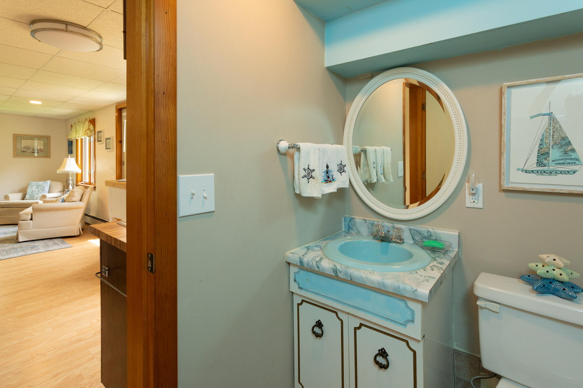 21 Captain Isiah's Road Cotuit, MA 02635 - Photo 32 of 47 a bathroom with a granite countertop sink a mirror and a shower
