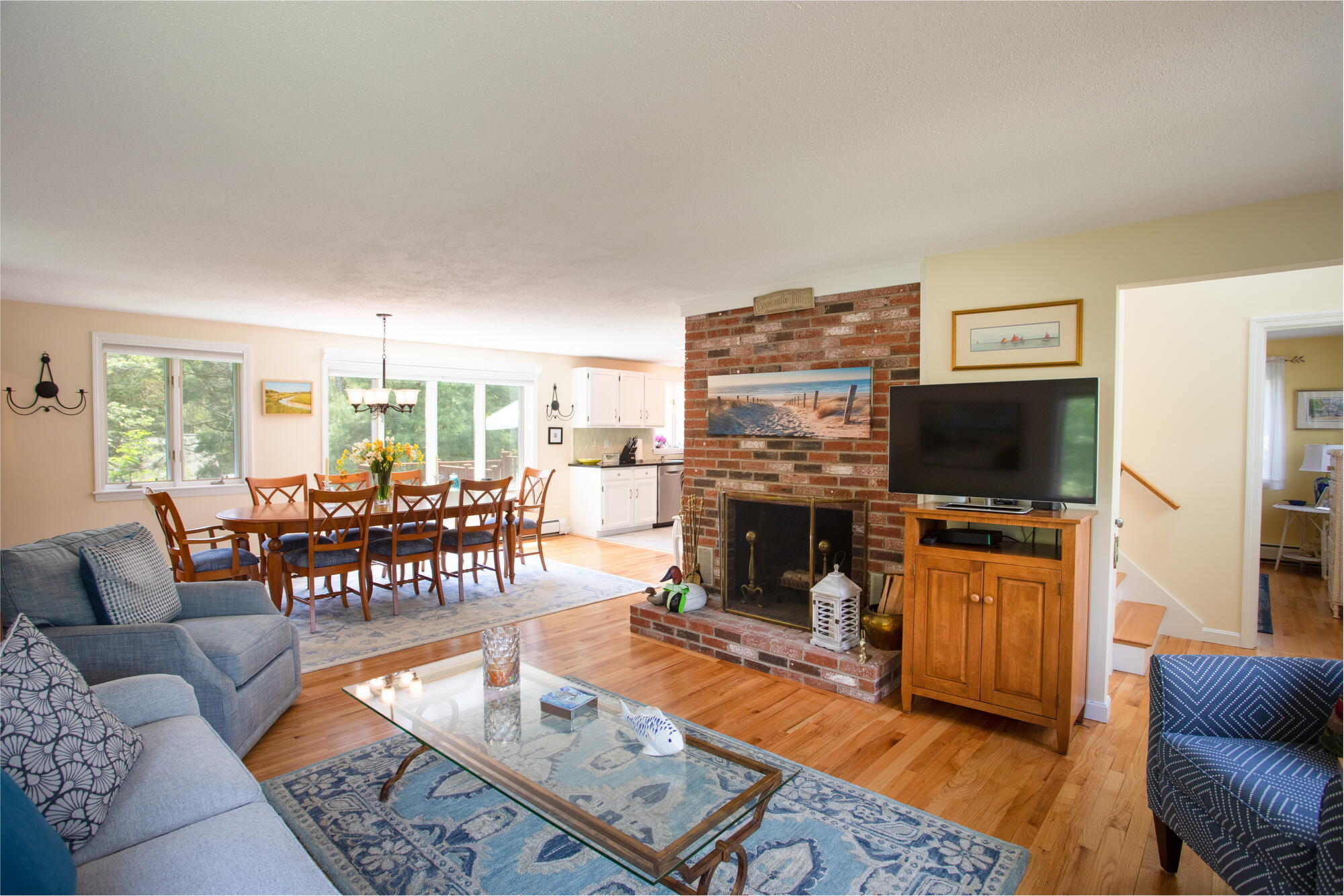 21 Captain Isiah's Road Cotuit, MA 02635 - Photo 8 of 47 a living room with furniture a flat screen tv and a fireplace