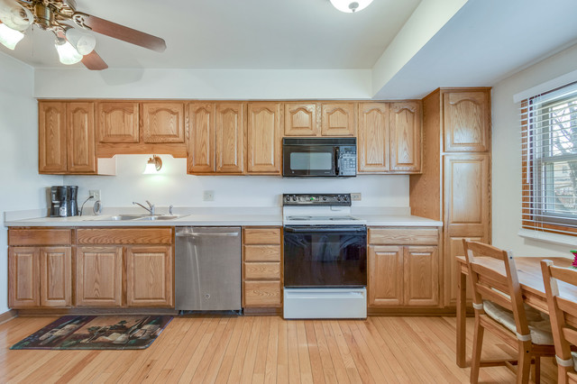 5001 Tile Line Road Crystal Lake, IL 60012 - Photo 11 of 30 a kitchen with granite countertop a stove a sink and a refrigerator