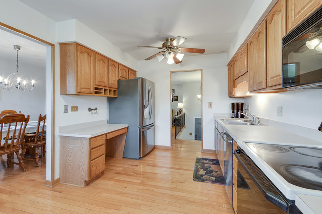 5001 Tile Line Road Crystal Lake, IL 60012 - Photo 13 of 30 a kitchen with stainless steel appliances granite countertop a sink stove and refrigerator