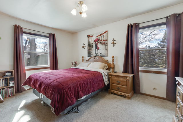 5001 Tile Line Road Crystal Lake, IL 60012 - Photo 16 of 30 a bed sitting in a bedroom next to a window
