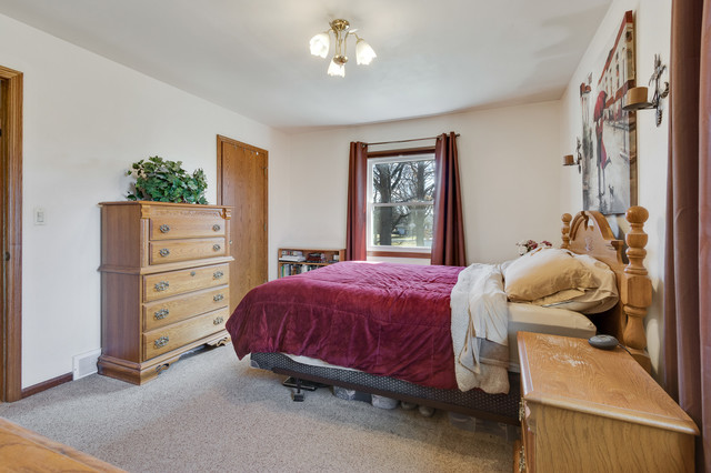 5001 Tile Line Road Crystal Lake, IL 60012 - Photo 18 of 30 a bed room with a bed and a window