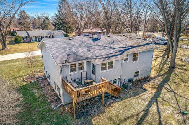 5001 Tile Line Road Crystal Lake, IL 60012 - Photo 3 of 30 a view of a house with backyard and trees