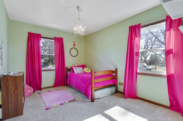 5001 Tile Line Road Crystal Lake, IL 60012 - Photo 21 of 30 a bedroom with a bed and a chandelier