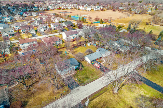 5001 Tile Line Road Crystal Lake, IL 60012 - Photo 6 of 30 an aerial view of residential houses with outdoor space