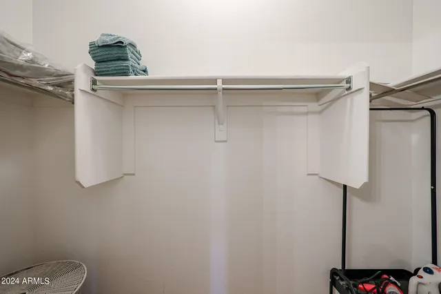 a balcony with table and chairs