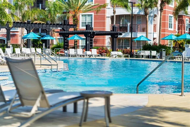 a view of a swimming pool with a lounge chairs