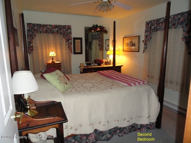 512 Myo Beach Road Meshoppen, PA 18630 - Photo 9 of 17 a bedroom with a bed dresser and a window