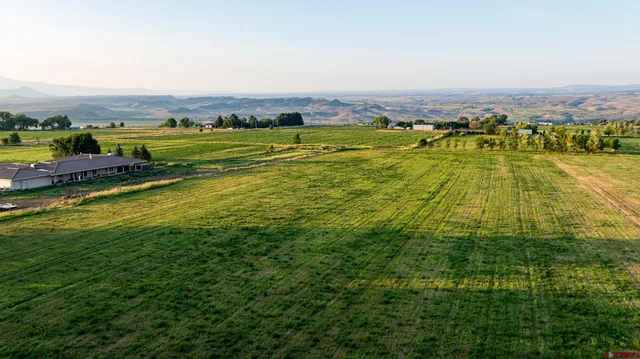 a kitchen with stainless steel appliances kitchen island granite countertop a refrigerator and a stove top oven