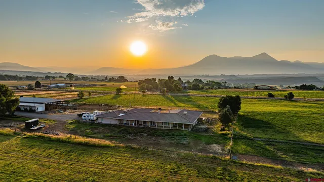 a kitchen that has a sink a stove and a refrigerator