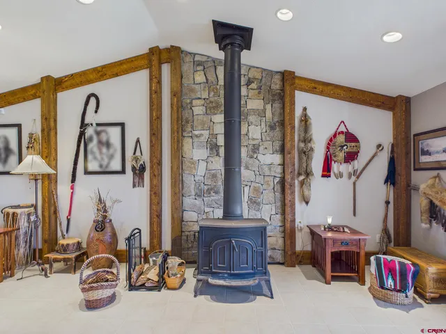 a bathroom with a bathtub a sink and a large mirror