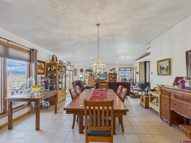 a living room with furniture and a gym machine