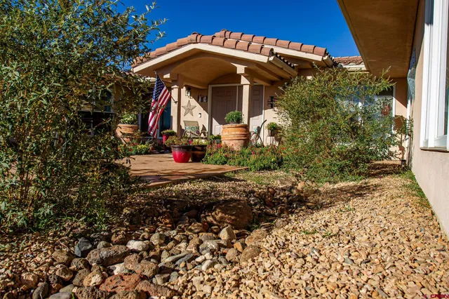 a view of a swimming pool with lawn chairs